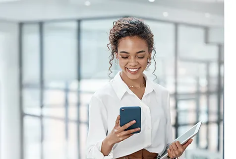 Lady smiling and checking her phone