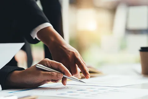 Man pointing at business plans