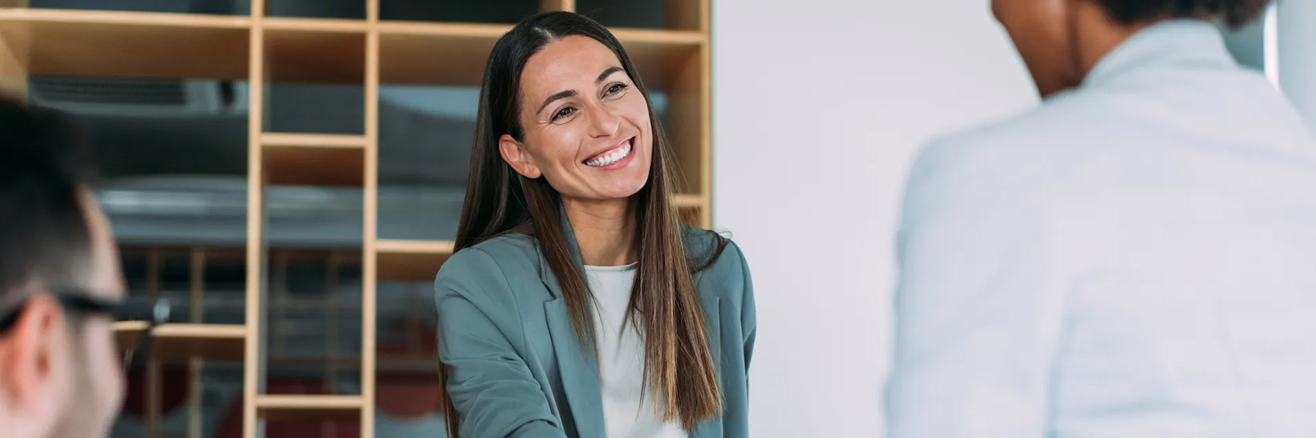 Lady associate smiling at another associate